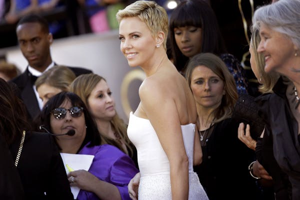 Charlize Theron arrives at the 85th annual Academy Awards