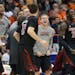 Louisville players react after Luke Hancock, foreground, scored against Syracuse