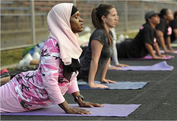 A Muslim trainer in Connecticut leads a fitness class.