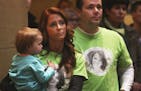 During the "Action Day" held by the Minnesota Coalition for Battered Women, Tonya Barthel held her daughter Ashlyn Watson, 1, as her boyfriend Jamie E