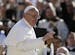 Pope Francis waves to crowds as he arrives to his inauguration Mass in St. Peter's Square at the Vatican, Tuesday, March 19, 2013.