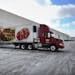 Tractor trailers are lined up at Supervalu's grocery distribution center Wednesday, Jan. 23, 2013, in Hopkins. The company announced that it will elim