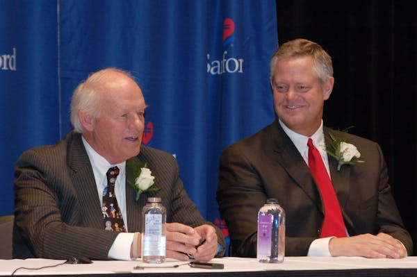 T. Denny Sanford, left, with CEO Kelby Krabbenhoft in 2007