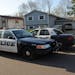 Police on Tuesday, April 10, 2012, investigated the scene of a fatal shooting where 3 people were found dead in Brooklyn Park, Minn.