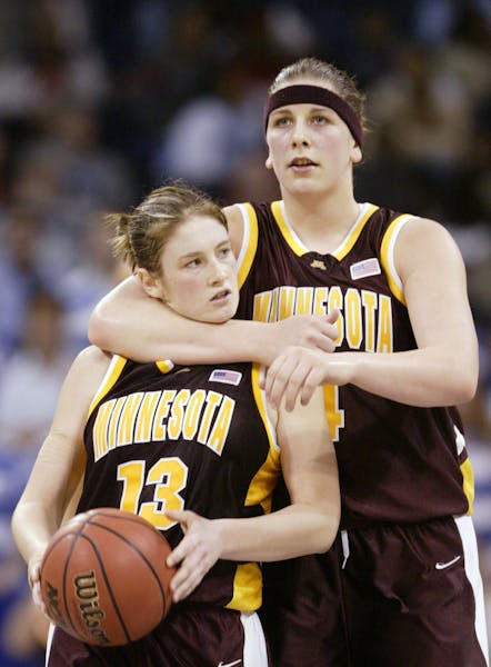 * McCarville huggedGophers teammate Lindsay Whalen as they secured their Mideast Regional final victory over Duke in 2004.