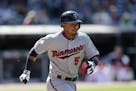 Minnesota Twins' Eduardo Escobar runs out a ground ball in the ninth inning of a baseball game against the Cleveland Indians, Sunday, May 5, 2013, in 