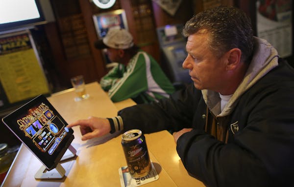 Randy Langenenks played an electronic pulltab game at Porky’s, a small St. Paul bar that consistently ranks in the Top 10 in the sale of e-pulltabs 