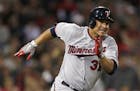 Minnesota Twins' Oswaldo Arcia dashes down the first base line on a double during the fourth inning of a baseball game against the Boston Red Sox at F