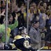Fans cheer as Boston Bruins defenseman Torey Krug (47) celebrates his goal against the New York Rangers during the first period in Game 2 of the NHL E