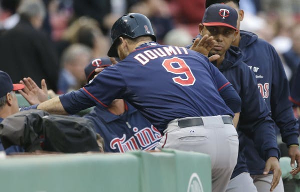 Designated hitter Ryan Doumit was welcomed back into the dugout after his two-run homer against the Red Sox during the Twins’ four-run first inning.