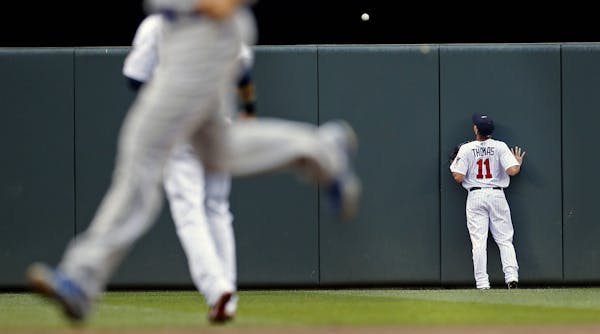 Twins center fielder Clete Thomas watched a ball hit by Royals slugger Billy Butler land over the fence for a three-run homer in the first inning. It 