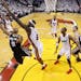 San Antonio Spurs point guard Tony Parker (9) heads to the hoop as Miami Heat small forward LeBron James (6) defends during the first half of Game 1 o