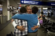 Miguel Vazquez was greeted at the Minneapolis-St. Paul airport by his wife and 13-year-old son. He overstayed his visa and was deported in 2002.