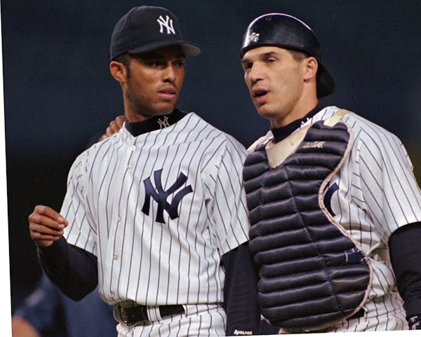 Talk about longevity:   Then-Yankees catcher Joe Girardi, right, worked with Mariano Rivera in 1997. Now, Girardi is his manager.