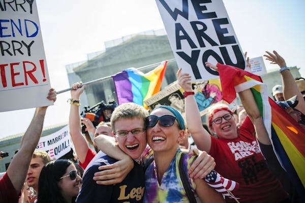 Supporters of same sex marriage celebrate outside the Supreme Court after hearing that the Court struck down the Defense of Marriage Act, Wednesday, J