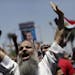 Supporters of ousted Egypt's President Mohammed Morsi chant slogans during a protest near the University of Cairo, Giza, Egypt, Friday, July 5, 2013. 
