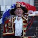 Tony Appleton, a town crier, announces the birth of the royal baby, outside St. Mary's Hospital exclusive Lindo Wing in London, Monday. Palace officia