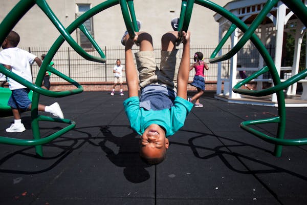 Mehki Lee, 5, plays on the playground at Union Baptist-Harvey Johnson Head Start summer camp in Baltimore, Aug. 5, 2013. The obesity rate among young 
