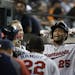 Minnesota Twins' Pedro Florimon flexes after hitting a solo home run against the Detroit Tigers in the sixth inning of a baseball game in Detroit, Tue
