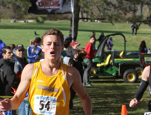 Caption: Phillip LaVallee crossing the finish line at the 2012 Summit League Cross Country Championships. He placed 15th in the meet during his freshm