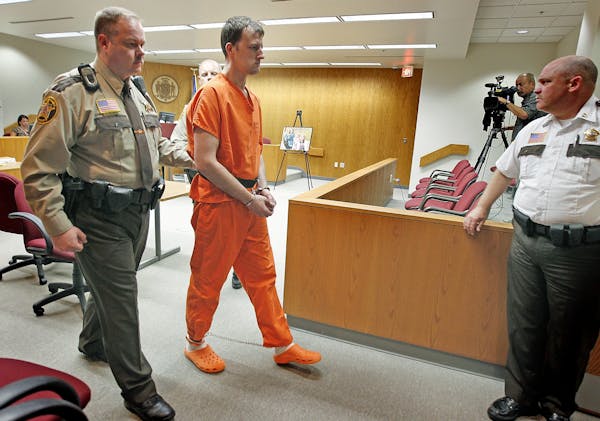 Aaron Schaffhausen is led from a St. Croix County courtroom after being sentenced to three consecutive life terms in prison on Monday.