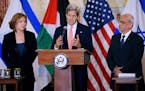 U.S. Secretary of State John Kerry (center) delivers remarks as Israeli Justice Minister Tzipi Livni (left) and Palestinian chief negotiator Saeb Erek