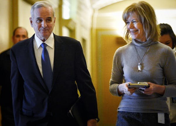 Governor Dayton's chief of Staff Tina Smith, right, accompanied Governor Mark Dayton who spoke to reporters about the State of Minnesota February Budg