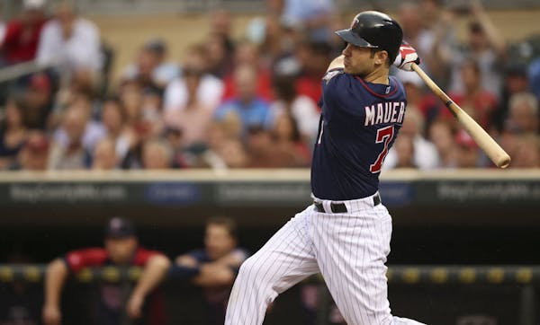 Joe Mauer hit an RBI single to left in his first at-bat of his first game back with the team since becoming a father last week.