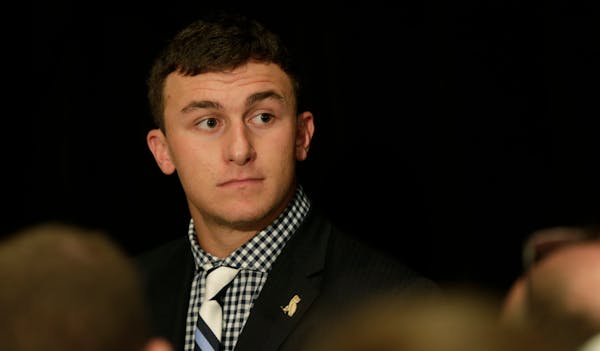 Texas A&M quarterback Johnny Manziel talked with reporters during the Southeastern Conference media days last month. ESPN reported that the NCAA is in