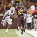 Gophers running back David Cobb ran 60 yards downfield in the fourth quarter before UNLV defensive back Kenneth Penny tackled him