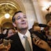 Sen. Ted Cruz, R-Texas talks to reporters as he emerges from the Senate Chamber on Capitol Hill in Washington, Wednesday, Sept 25, 2013, after his ove