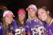 Holly Wruck, right, wore pink for breast cancer awareness at a Vikings game along with friends, from left, Darcy Schopf, Christie Carrera, Steph Lause