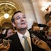 Sen. Ted Cruz, R-Texas talks to reporters as he emerges from the Senate Chamber on Capitol Hill in Washington, Wednesday, Sept 25, 2013, after his ove