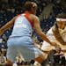 Seimone Augustus of the Lynx sized up Angel McCoughtry of the Atlanta Dream during the first quarter of Game 2 of the WNBA Finals on Tuesday, October 