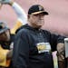 FILE - In this Oct. 9, 2013, file photo, Pittsburgh Pirates manager Clint Hurdle, right, watches his team warm up for Game 5 of a NL baseball division