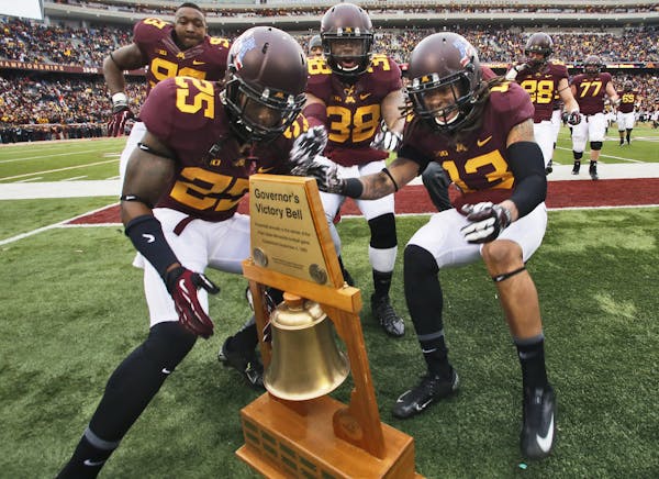 Gophers players sprinted across the field to claim the Governor’s Victory Bell after beating Penn State 24-10, but part of the wooden frame got brok
