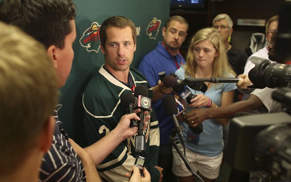 Defenseman Keith Ballard talked to reporters after signing with the Wild on Friday.