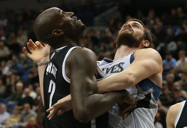 Wolves Kevin Love and Nets Kevin Garnett fought for position under the basket during the first half at the Target Center in Minneapolis, Friday, Novem