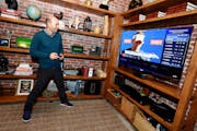 Paul Scheer of The League uses The NFL on Xbox One to check his fantasy team.