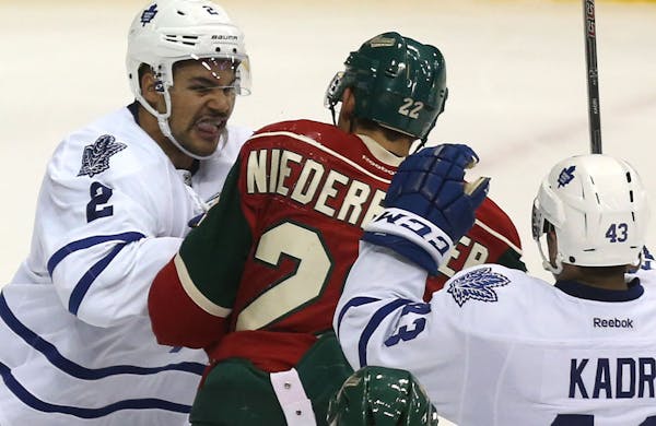Maple Leafs Mark Fraser fought with the Wild's Nino Niederreiter during the second period at Xcel Energy Center in St. Paul on Nov. 13.