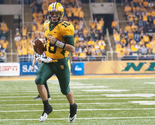 North Dakota State quarterback Brock Jensen ran for two touchdowns Saturday against Coastal Carolina in Fargo, N.D.