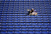 Jason Stockwell and his wife, Maria Zaruma, lifelong Vikings fans from Columbia Heights, linger in their seats at the close of Sunday’s game.