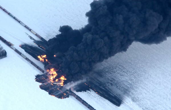 A fire from a train derailment burns uncontrollably Dec. 30, 2013, west of Casselton, N.D.