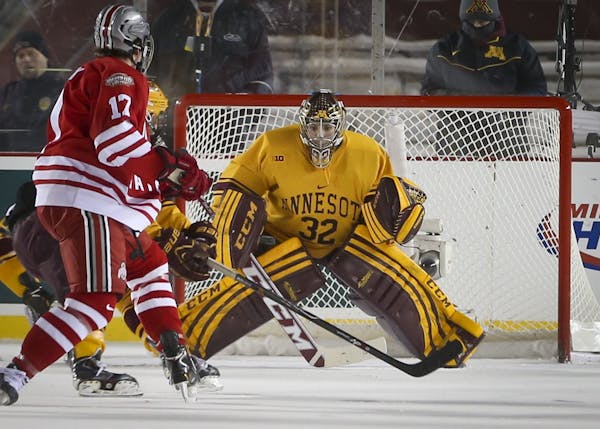 Minnesota goalie Adam Wilconx blocked a shot on goal by Ohio's Max McCormick in the first period during the Minnesota Gophers men's hockey vs. Ohio St