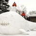 THEY BUILD A LAND SHARK: Brothers Trevor, Connor, and Austin Bartz built this 16-foot-high snow shark in the front yard of their New Brighton home. It