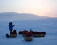 This photo provided by the Bancroft Arnesen Explore shows Ann Bancroft of Minnesota talking on a satellite phone during a North Pole expedition with N