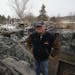 Bill Urseth, co-owner of the Minnesota Horse and Hunt Club, stood in the ruins of his clubhouse-restaurant, which was destroyed by fire last week. The