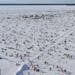 Up to 10,000 anglers scattered across Gull Lake’s Hole In The Day Bay despite the frigid temperatures. As many as 20,000 holes were predrilled.