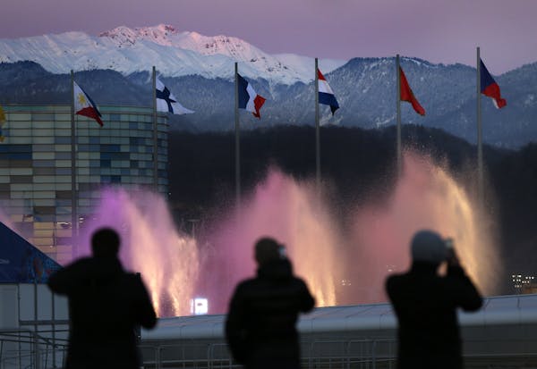Spectators photographed water fountains at Olympic Park during final preparations for the 2014 Winter Olympics.