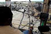 Mosaic Co. operator works a phosphate dragline at the company's production site near Tampa, Fla. Mosaic reported a small net loss in the first three m